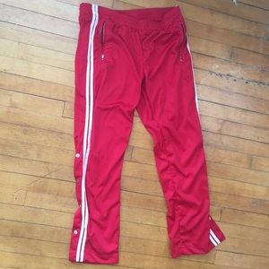 Red track pants with snaps